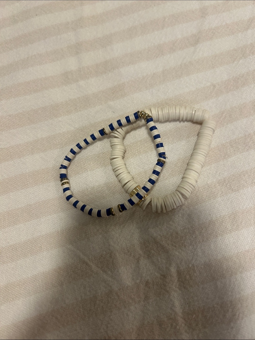 Stack of White and Blue Striped Bead Coil Bracelets